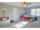Spacious bedroom with natural light, carpeted floor and dresser set at 75 Price Dr, Locust Grove, GA 30248