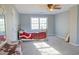 Spacious bedroom with natural light, carpeted floor and dresser set at 75 Price Dr, Locust Grove, GA 30248