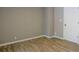 Cozy bedroom with neutral paint, vinyl floors, and a white door at 75 Price Dr, Locust Grove, GA 30248