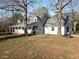 Charming exterior view of home featuring a covered porch, gabled roof, and a well-kept lawn at 75 Price Dr, Locust Grove, GA 30248