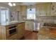 Bright kitchen featuring stainless steel appliances and gorgeous granite countertops at 75 Price Dr, Locust Grove, GA 30248