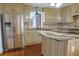 Eat-in kitchen features stainless steel appliances, granite countertops, and custom cabinetry at 75 Price Dr, Locust Grove, GA 30248