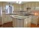 Eat-in kitchen featuring granite countertops, stainless steel appliances, and custom cabinetry at 75 Price Dr, Locust Grove, GA 30248