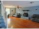 Comfortable living room with a stone fireplace and hardwood floors at 75 Price Dr, Locust Grove, GA 30248