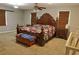 Spacious bedroom with a ceiling fan, two large windows, and hardwood floors at 75 Price Dr, Locust Grove, GA 30248