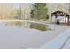 Backyard pool with a gazebo-covered grilling area ready for outdoor entertaining at 75 Price Dr, Locust Grove, GA 30248