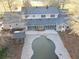 Rear exterior view of a light blue single Gathering home with a screened-in porch and pool at 75 Price Dr, Locust Grove, GA 30248