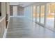 Bright sunroom with large windows overlooking outdoor area and gray floors at 75 Price Dr, Locust Grove, GA 30248