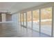 Sunroom with windows, light gray floors and backyard view at 75 Price Dr, Locust Grove, GA 30248