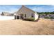 A large back yard featuring dormant grass surrounded by privacy fence at 146 Point View Dr, Canton, GA 30114