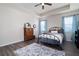 Cozy bedroom with modern flooring, tray ceiling, and ample natural light from two windows at 146 Point View Dr, Canton, GA 30114