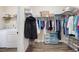 Spacious walk-in closet with ample storage, shelving, and laundry area at 146 Point View Dr, Canton, GA 30114