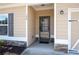 Close-up showcasing the front entrance with stone accents, a modern door, and a well-lit porch at 146 Point View Dr, Canton, GA 30114