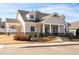 A beautiful front view of a home with dormers and a covered front porch with stone accents at 146 Point View Dr, Canton, GA 30114