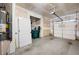 A two car garage that is bright, clean, and spacious with a utility area for water heater and door to interior at 146 Point View Dr, Canton, GA 30114