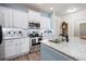 Well-equipped kitchen featuring granite countertops, stainless steel appliances, and ample cabinet space at 146 Point View Dr, Canton, GA 30114