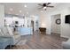 Open-concept living space with modern flooring, recessed lighting, and connected kitchen area at 146 Point View Dr, Canton, GA 30114