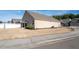 A side view of the home with dormant grass, walkway, and utilities visible at 146 Point View Dr, Canton, GA 30114