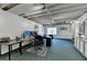 Finished basement with an office set up, exposed ceiling and painted walls at 2030 Habersham Trce, Cumming, GA 30041