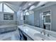 Beautiful bathroom with double sinks, a large mirror, and a luxurious tub at 2030 Habersham Trce, Cumming, GA 30041