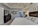 Well-lit primary bedroom with a door leading to the luxurious bathroom at 2030 Habersham Trce, Cumming, GA 30041