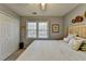 Inviting bedroom featuring a double window, closet, and comfortable bed with decorative pillows at 2030 Habersham Trce, Cumming, GA 30041