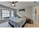 Cozy bedroom featuring a window seat, ceiling fan and neutral color palette at 2030 Habersham Trce, Cumming, GA 30041