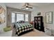 Bright bedroom with bay window, desk, and ample natural light at 2030 Habersham Trce, Cumming, GA 30041