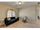 Cozy bedroom with natural light, rocking chair, and comfortable sofa at 2030 Habersham Trce, Cumming, GA 30041