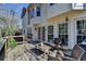 A beautiful deck offers outdoor seating, a table, and views of the backyard and trees, ideal for relaxation at 2030 Habersham Trce, Cumming, GA 30041