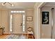 Welcoming foyer with hardwood floors, a decorative rug, and a charming 'Home Sweet Home' pillow at 2030 Habersham Trce, Cumming, GA 30041