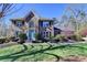 Inviting two-story brick home featuring a well-manicured lawn and vibrant landscaping at 2030 Habersham Trce, Cumming, GA 30041