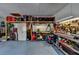 Well-organized garage featuring built-in shelving and ample space for storage and projects at 2030 Habersham Trce, Cumming, GA 30041