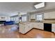 Bright kitchen features white cabinets, black appliances, and a pass-through to the living area at 2030 Habersham Trce, Cumming, GA 30041