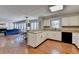 Open kitchen featuring white cabinets, black appliances, and hardwood floors at 2030 Habersham Trce, Cumming, GA 30041