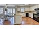 Kitchen with white cabinets and stainless steel appliances and eat in dining space at 2030 Habersham Trce, Cumming, GA 30041