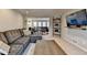 Open-concept living room featuring comfortable seating and stylish decor at 2030 Habersham Trce, Cumming, GA 30041