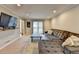 Spacious living room with a plush sectional sofa, large window, and modern decor at 2030 Habersham Trce, Cumming, GA 30041