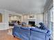 Open-concept living space with a fireplace, couch, and natural light at 2030 Habersham Trce, Cumming, GA 30041
