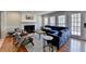 Cozy sitting room features a fireplace, blue couch, and natural light at 2030 Habersham Trce, Cumming, GA 30041