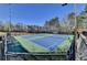 Well-maintained tennis courts in a serene community setting with a clear blue sky at 2030 Habersham Trce, Cumming, GA 30041