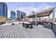 City view from rooftop deck featuring covered seating and dining areas at 1029 Piedmont Ne Ave # 305, Atlanta, GA 30309