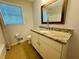 Bathroom features granite countertops, white cabinets, and a large mirror at 3210 Ebenezer Rd, Marietta, GA 30066