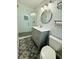 The bathroom features updated vanity, decorative floor tiles, modern lighting and glass enclosed shower at 3210 Ebenezer Rd, Marietta, GA 30066