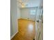 Bedroom has wood floors, a ceiling fan, and a window for natural light at 3210 Ebenezer Rd, Marietta, GA 30066