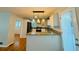 Bright kitchen features granite countertops, pendant lighting, and stainless steel appliances at 3210 Ebenezer Rd, Marietta, GA 30066