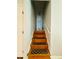 A well-lit stairway features wooden steps and white walls at 3210 Ebenezer Rd, Marietta, GA 30066