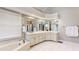 Bright bathroom featuring a soaking tub and a vanity with drawers and cabinets at 5189 Brooke Farm Dr, Atlanta, GA 30338