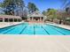 Enjoy this expansive community pool and shaded cabana for fun and relaxation at 5189 Brooke Farm Dr, Atlanta, GA 30338