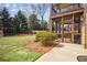 The private backyard features a screened porch and wooden playset for outdoor enjoyment at 1211 Thornwell Ne Dr, Brookhaven, GA 30319